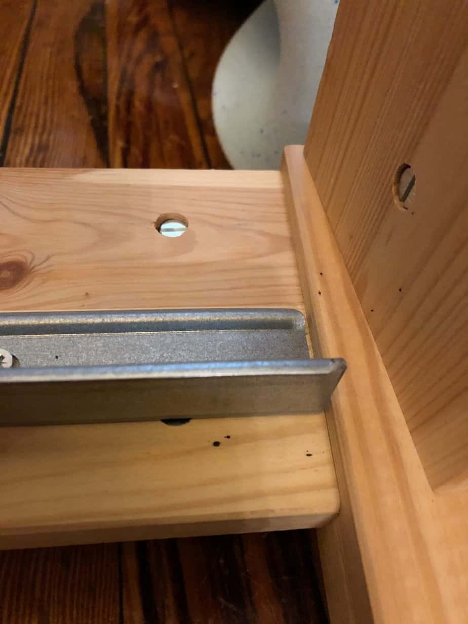 fecal stains from bed bugs on a bed frame